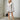 Luxury women's gray faux fur coat in size 3XL, showcasing long sleeves, a high neckline, and a knee-length design. The coat features a soft, textured textile with shades of white and gray, perfect for winter fashion.