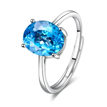 Luxury yellow diamond ring with a round cut on 925 sterling silver band, featuring an electric blue sapphire accent.