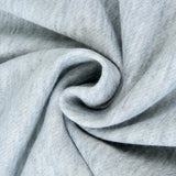 Grey textured fabric hoodie featuring long sleeves and a collar, designed for lightweight casual wear. Close-up shows the fabric's pattern and jersey material.