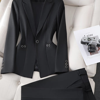 Women's teal textured blazer with black accents, designed for office wear. The blazer is displayed on a hanger against a white background, showcasing its sleek and professional style.