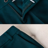 Women's teal textured blazer with a classic collar and long sleeves, designed for office wear.