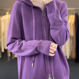 
A women's oversized knitted cardigan in a deep magenta color, featuring a hood and a zipper closure. The cardigan has long sleeves and a cozy, relaxed fit, suitable for plus-size wearers.