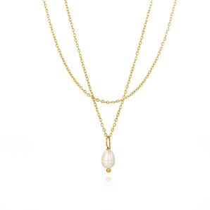 A delicate minimalist gold necklace with layered design, featuring hypoallergenic pearl accents.