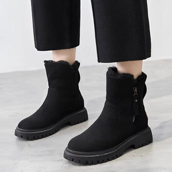 Black Maria™ women's cozy winter ankle boots with fur lining and slip-resistant soles, shown on a human leg, size 42.