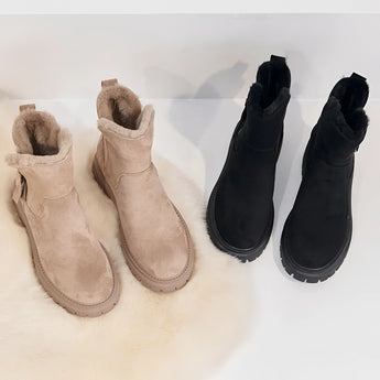 Cozy winter ankle boots for women with fur lining and slip-resistant soles, featuring a stylish design and electric blue color.