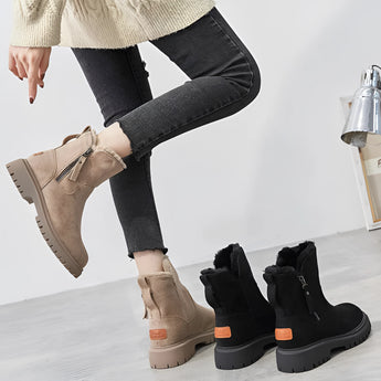 
Women's cozy winter ankle boots with fur lining, featuring a slip-resistant sole, shown in a black and white color scheme.