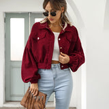 Maroon cropped women's suede jacket in size XL, styled with trendy casual fashion, featuring a rich Bordeaux color. The model is accessorized with sunglasses, wearing the jacket over a white top and trousers.