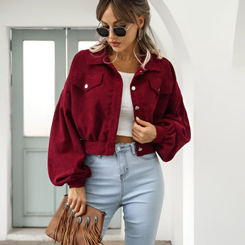 Maroon cropped women's suede jacket in size XL, styled with trendy casual fashion, featuring a rich Bordeaux color. The model is accessorized with sunglasses, wearing the jacket over a white top and trousers.