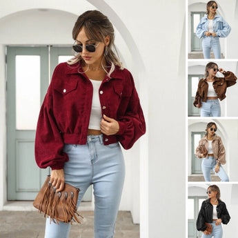 Maroon cropped women's suede jacket displayed on a mannequin, showcasing trendy casual fashion with visible shoulder and arm details.