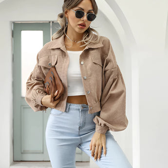 Maroon cropped women's suede jacket displayed with a trendy casual fashion style, featuring a khaki color in an XL size. The jacket is paired with accessories such as sunglasses, highlighting its fashionable appeal.