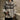 Men's beige argyle sweater in neutral knit wool blend, featuring a classic pattern, long sleeves, and a comfortable fit suitable for winter fashion. The sweater is worn by a model, highlighting the collar, sleeves, and waist area.