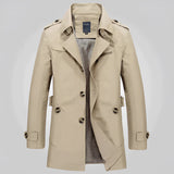 Men's beige double-breasted trench coat with epaulettes in khaki color, featuring a stylish collar, long sleeves, and button details in a formal fashion design.