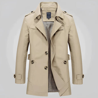 Men's beige double-breasted trench coat with epaulettes in khaki color, featuring a stylish collar, long sleeves, and button details in a formal fashion design.
