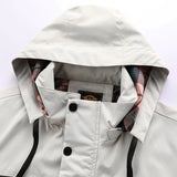 Men's beige hooded windbreaker jacket with a lightweight design, featuring long sleeves, a collar, and front buttons, suitable for spring wear.