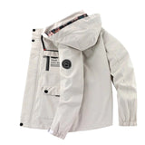 Men's beige hooded windbreaker with long sleeves and a lightweight design, featuring a collar and button details, ideal for spring weather and casual sportswear fashion.