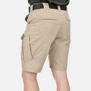 Men's beige lightweight cargo shorts with multiple utility pockets, featuring a comfortable fit around the waist and thighs, ending just above the knee.