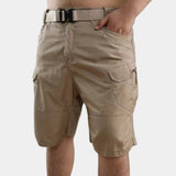 Men's beige lightweight cargo shorts with multiple utility pockets, shown in a khaki color, highlighting the waist and thigh area.