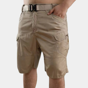 Men's beige lightweight cargo shorts with multiple utility pockets, shown in a khaki color, highlighting the waist and thigh area.
