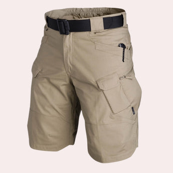 Men's beige lightweight cargo shorts with multiple pockets, shown in khaki color and size 44, designed for durability and utility, suitable for outdoor activities.