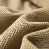 Men's beige lightweight wool crewneck sweater featuring a soft knit texture, displayed in a neutral color palette with subtle patterns, ideal for fall fashion.
