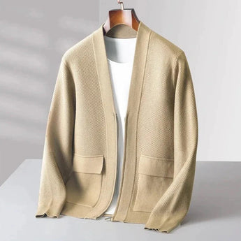 Men's beige lightweight wool crewneck sweater displayed on a hanger, showcasing its long sleeves and soft knit texture. The sweater appears to be suitable for fall fashion, emphasizing its cozy and stylish design.