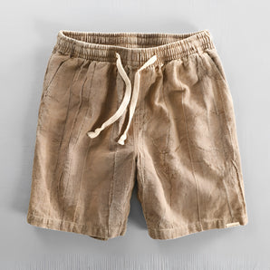 Men's beige linen drawstring shorts in size 2XL, lightweight and breathable fabric, shown in a close-up featuring the waist and drawstring detail.