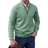 Men's green quarter zip sweater with a ribbed collar, worn by a model, showcasing the sleeve and collar details.