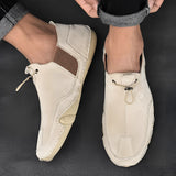 Men's beige suede slip-on loafers displayed in casual and breathable design, showcasing natural material and fashion accessory elements with no visible pattern, in size 47.