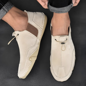 Men's beige suede slip-on loafers, showcasing a lightweight and stylish design with a smooth finish, ideal for casual wear.