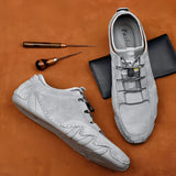 Men's light grey suede slip-on loafers, casual and breathable design, perfect for outdoor and walking activities, styled as a fashionable and comfortable footwear option.