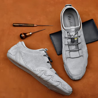 Men's light grey suede slip-on loafers, casual and breathable design, perfect for outdoor and walking activities, styled as a fashionable and comfortable footwear option.