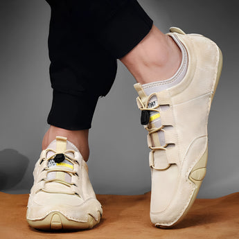 Men's beige suede slip-on loafers displayed on a plain background, showcasing their casual and breathable design.