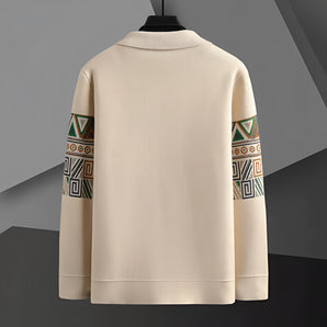 Men's beige sweatshirt featuring a tribal geometric pattern on the sleeves, displayed on a clothes hanger.