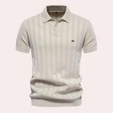Men's beige vertical stripe short sleeve polo in ribbed cotton, featuring a classic collar and button-up design in an apricot XL size.