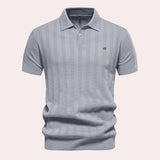 Men's beige short sleeve polo shirt with vertical stripes, ribbed cotton texture, and a collar, shown in gray color, size XL.