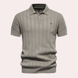 Men's beige vertical stripe short sleeve polo in ribbed cotton featuring a classic collar and button detail, shown in khaki color and XL size.