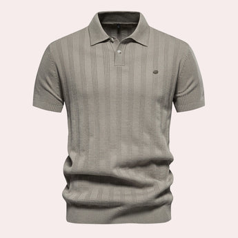 Men's beige vertical stripe short sleeve polo in ribbed cotton featuring a classic collar and button detail, shown in khaki color and XL size.