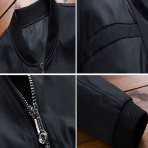 Men's black bomber jacket made of sleek nylon material, featuring a durable zipper, ribbed collar, cuffs, and hem, with long sleeves and an urban fashion design.