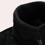 Men's black corduroy bomber jacket displayed on a mannequin, featuring a warm, durable design with ribbed cuffs and a sleek appearance.