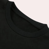 Men's black crew neck cotton t-shirt laid flat, showcasing short sleeves and soft, durable fabric.