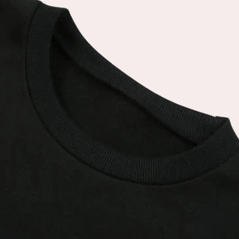 Men's black crew neck cotton t-shirt laid flat, showcasing short sleeves and soft, durable fabric.