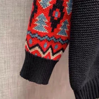 Men's black crewneck sweater featuring ethnic pattern sleeves made from woolen textile, displayed without a model.