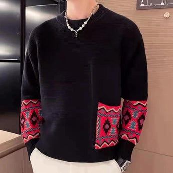 Men's black crewneck sweater featuring ethnic pattern sleeves, shown in size XL, with intricate detailing around the shoulder and neck area, highlighting the unique fashion design against a grey background.