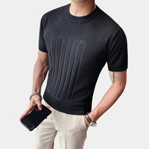Men's black embossed logo t-shirt with ribbed cuffs, shown in size 3XL, featuring a relaxed fit with visible shoulder seams and ribbed detail at the cuffs.