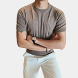 Men's khaki embossed logo t-shirt in size 3XL, featuring ribbed cuffs and a designer style, shown with emphasis on the collar and sleeves.