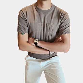 Men's khaki embossed logo t-shirt in size 3XL, featuring ribbed cuffs and a designer style, shown with emphasis on the collar and sleeves.