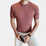 Men's black t-shirt featuring an embossed logo on the front, designed with ribbed cuffs, shown in light brown color variant.