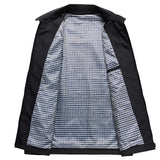 Men's black weatherproof trench coat with gingham lining, featuring long sleeves, a classic collar, and button closure.