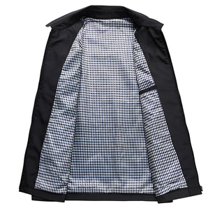 Men's black weatherproof trench coat with gingham lining, featuring long sleeves, a classic collar, and button closure.