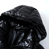 Men's black glossy hooded puffer jacket, insulated winter coat with sleeves, designed for cold weather and fashionable outerwear.